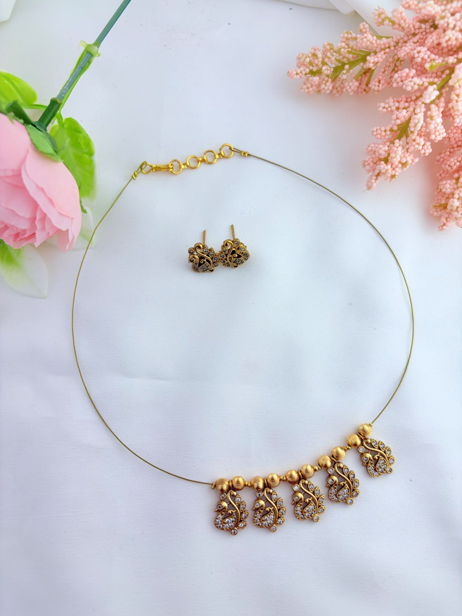 Timeless AD stone peacock pendant on an elegant invisible chain