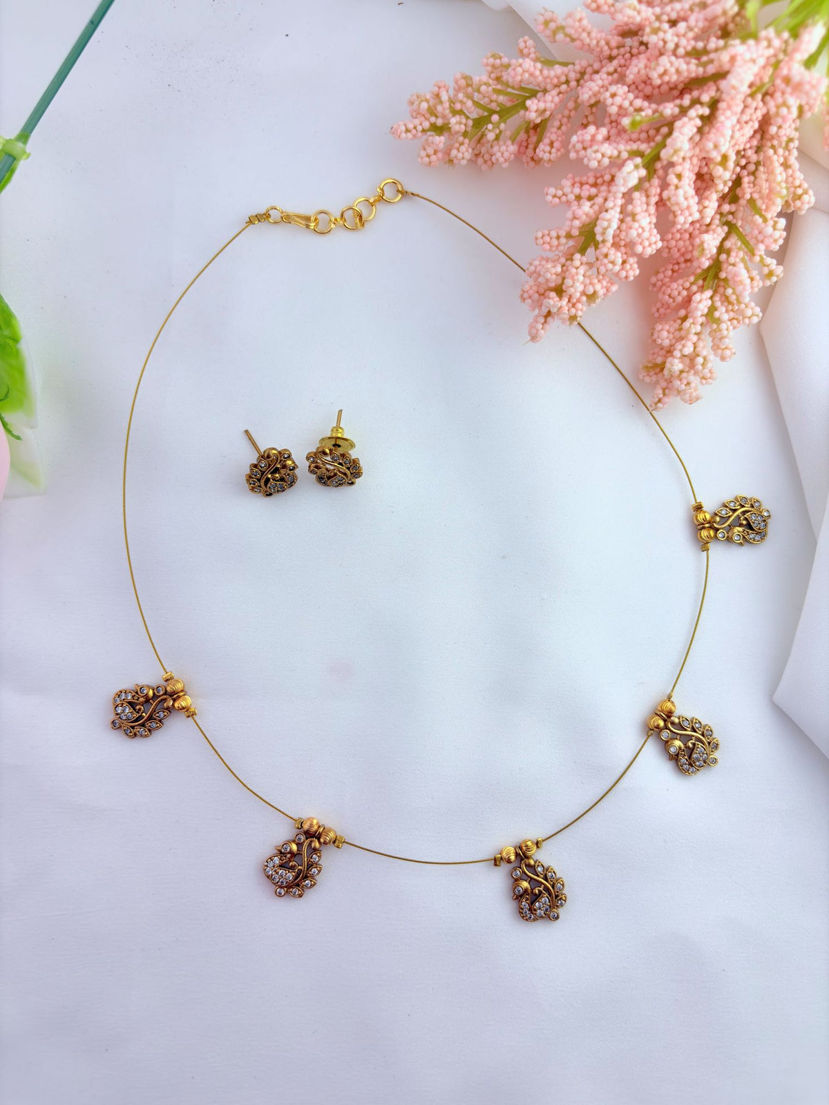 Elegant invisible chain featuring a beautifully crafted peacock pendant.