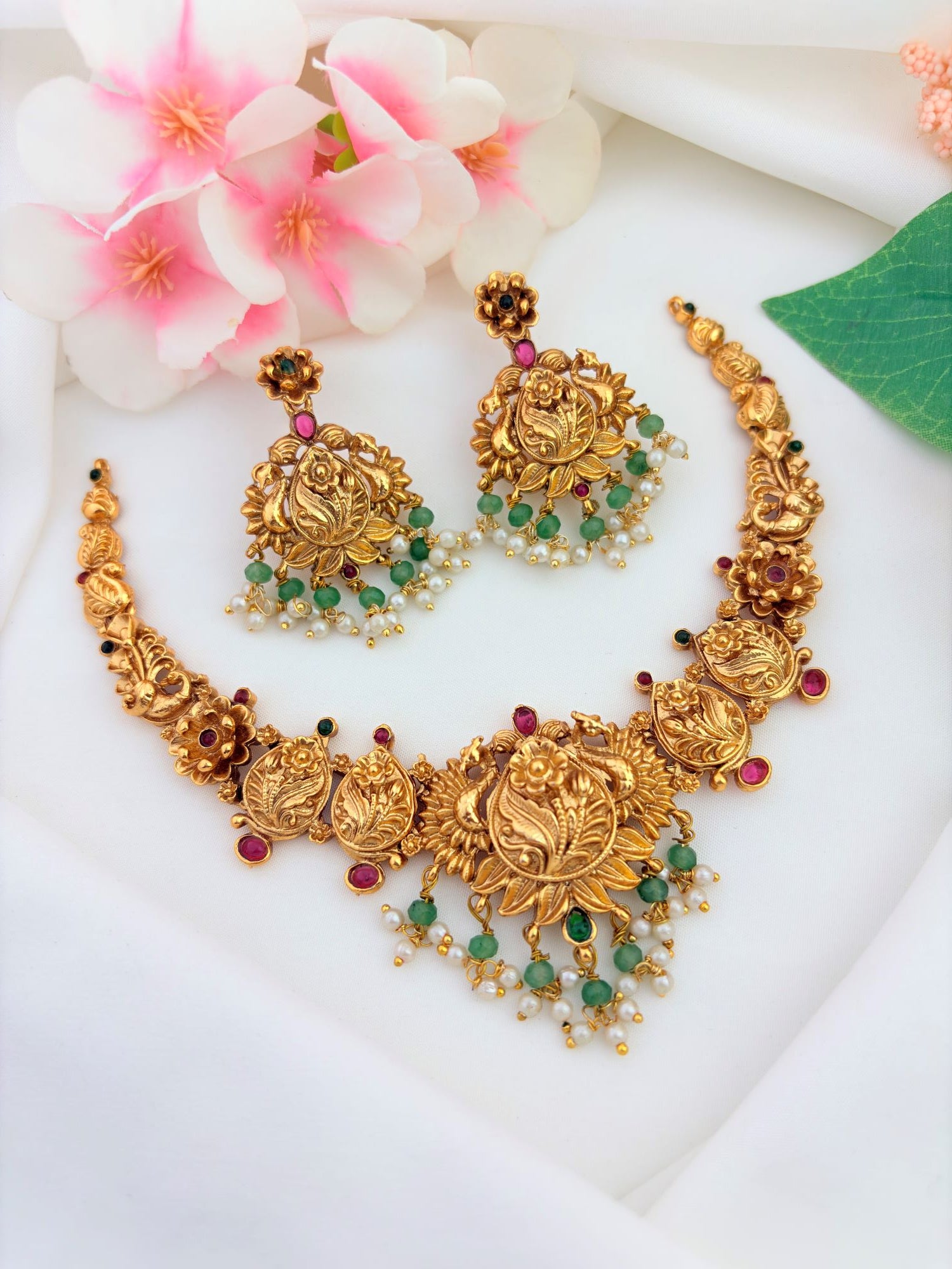 Traditional matte finish jewellery crafted with beautiful ruby and green stones - Non idol neckset