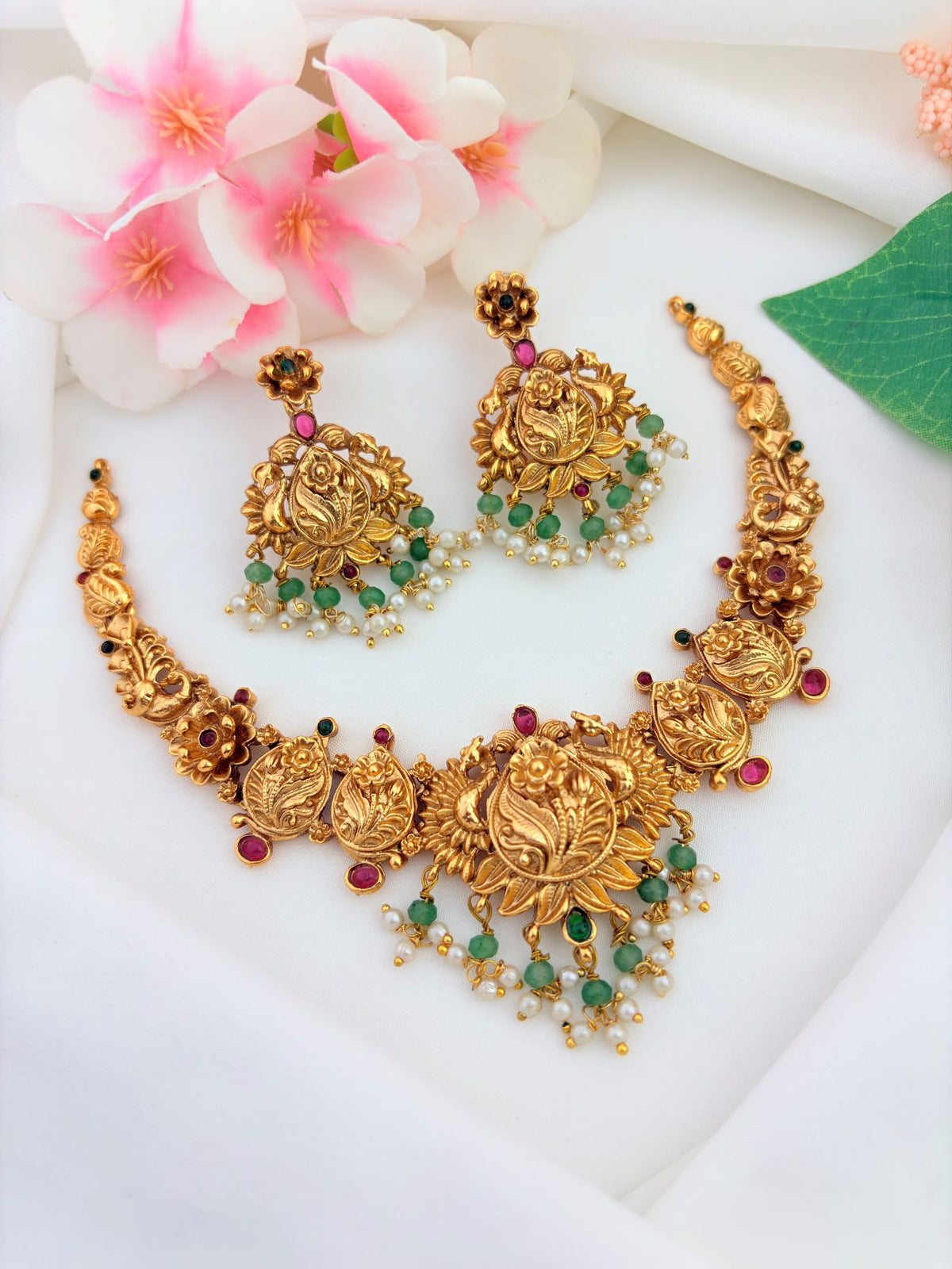 Traditional matte finish jewellery crafted with beautiful ruby and green stones - Non idol neckset