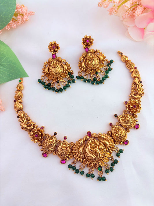 Traditional matte finish jewellery crafted with beautiful ruby and green stones - Non idol neckset