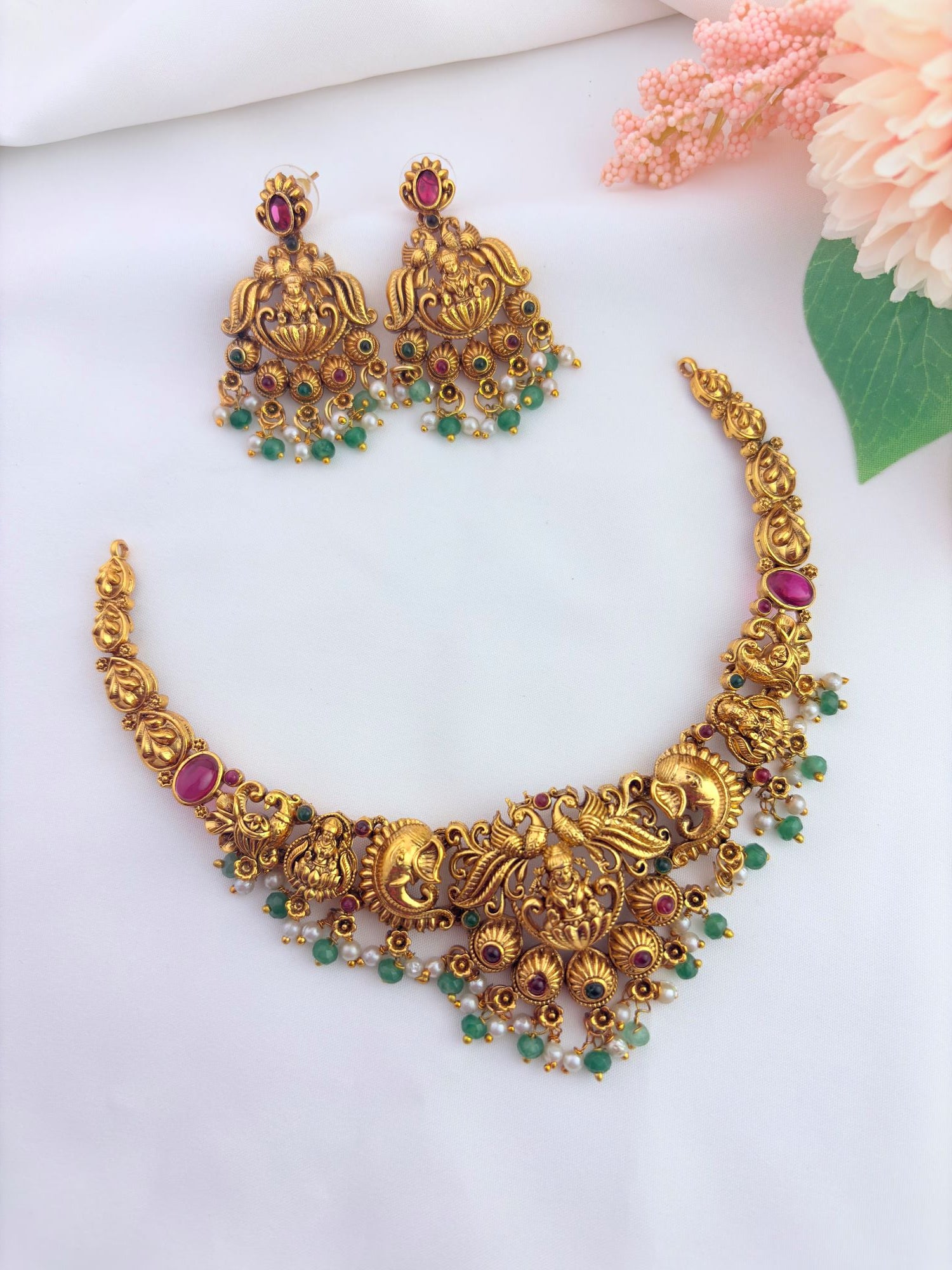 Elegant temple-inspired jewellery featuring intricate traditional designs, vibrant stones and delicate pearl detailing