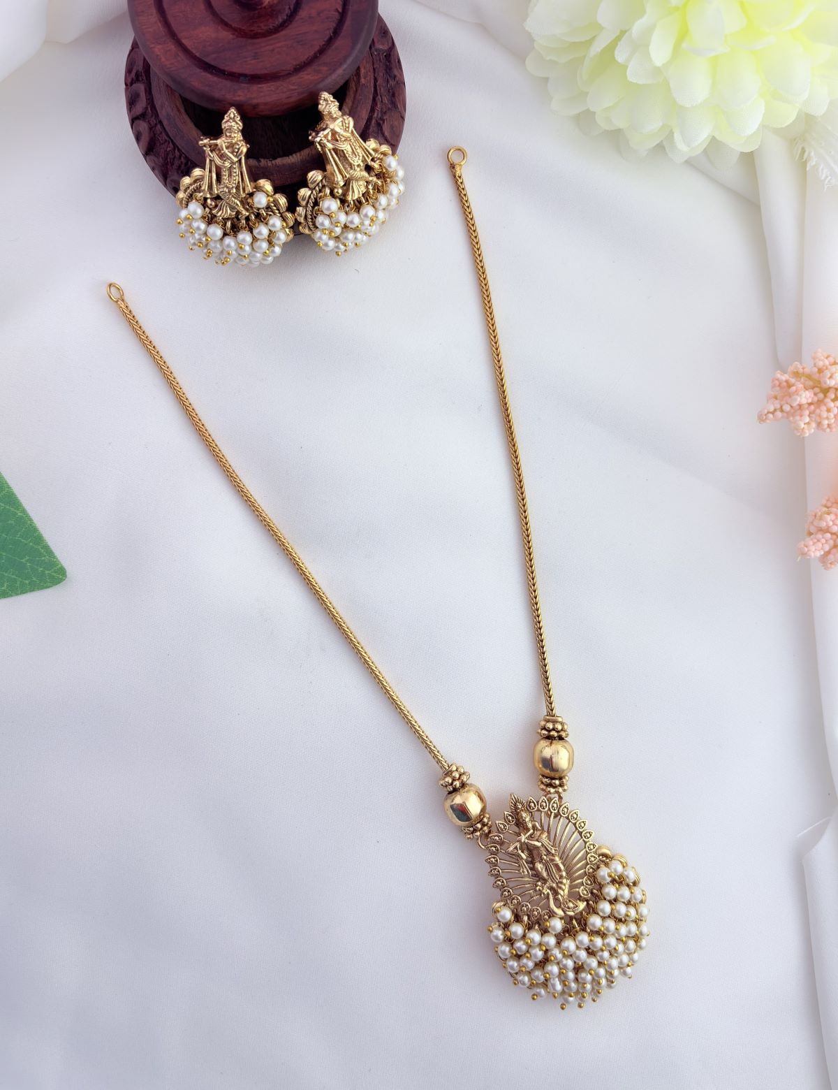 Tradition in modern elegance - krishna pendant set and earrings beautifully adorned with colorfull beads