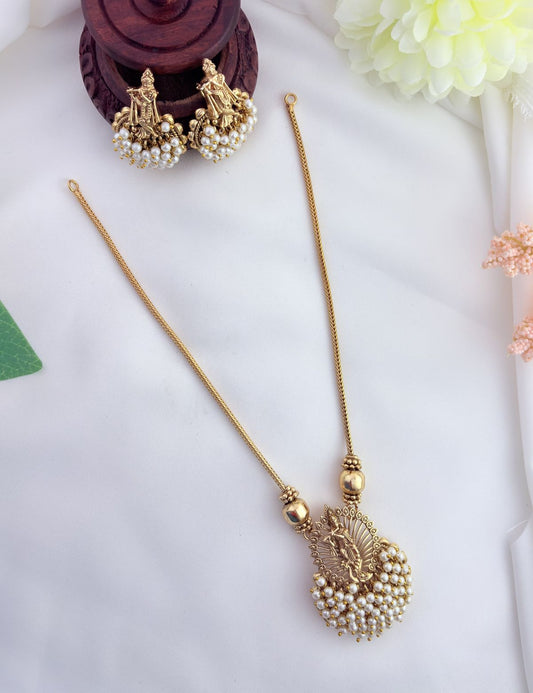 Tradition in modern elegance - krishna pendant set and earrings beautifully adorned with colorfull beads