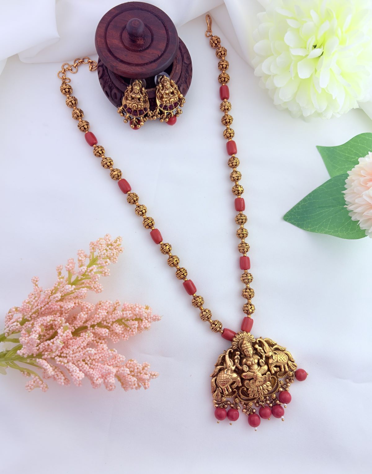 Matte finish lakshmi pendant and earrings  beautifully crafted with coral beads