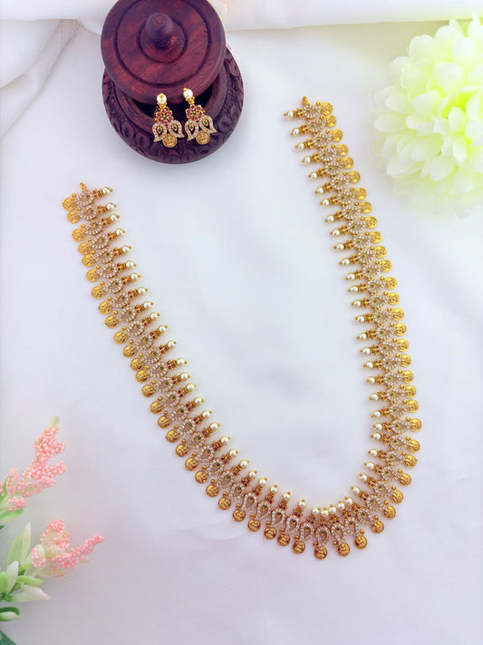 Tradition in modern elegance - Lakshmi coin and mango motif in single design beautifully crafted with AD stones and pearls