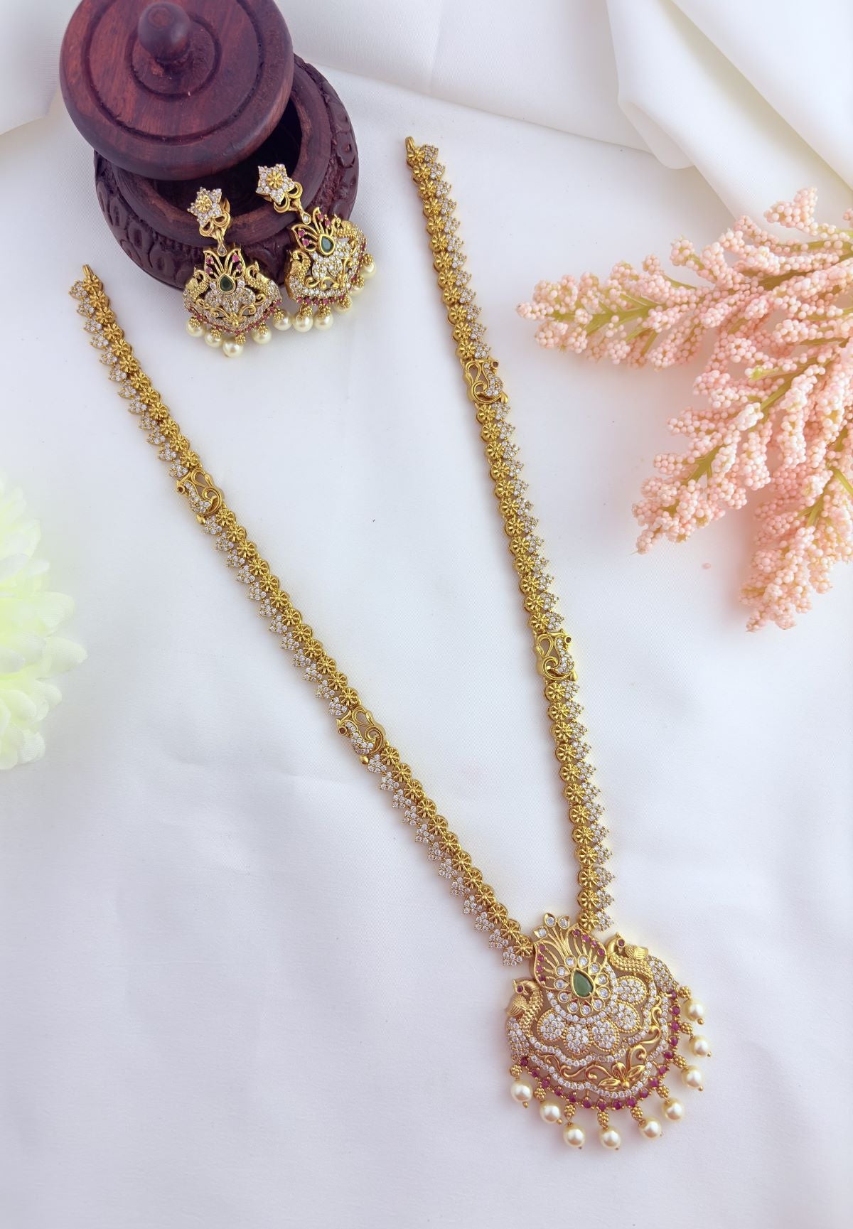 Stunning peacock motif pendant adorned with AD stones and pearl drops