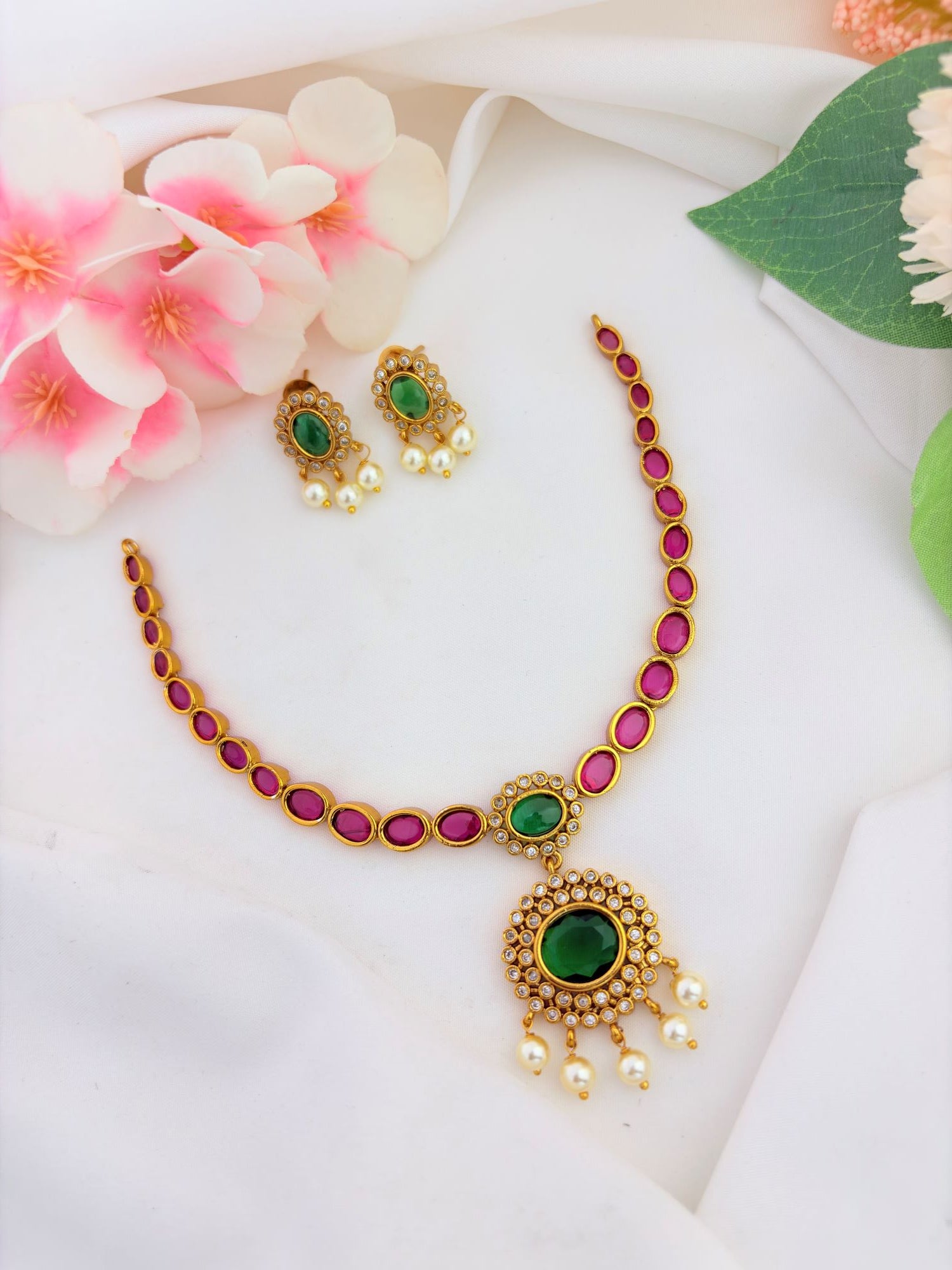 Elegant traditional neckset adorned with ruby, green stone and pearl drops