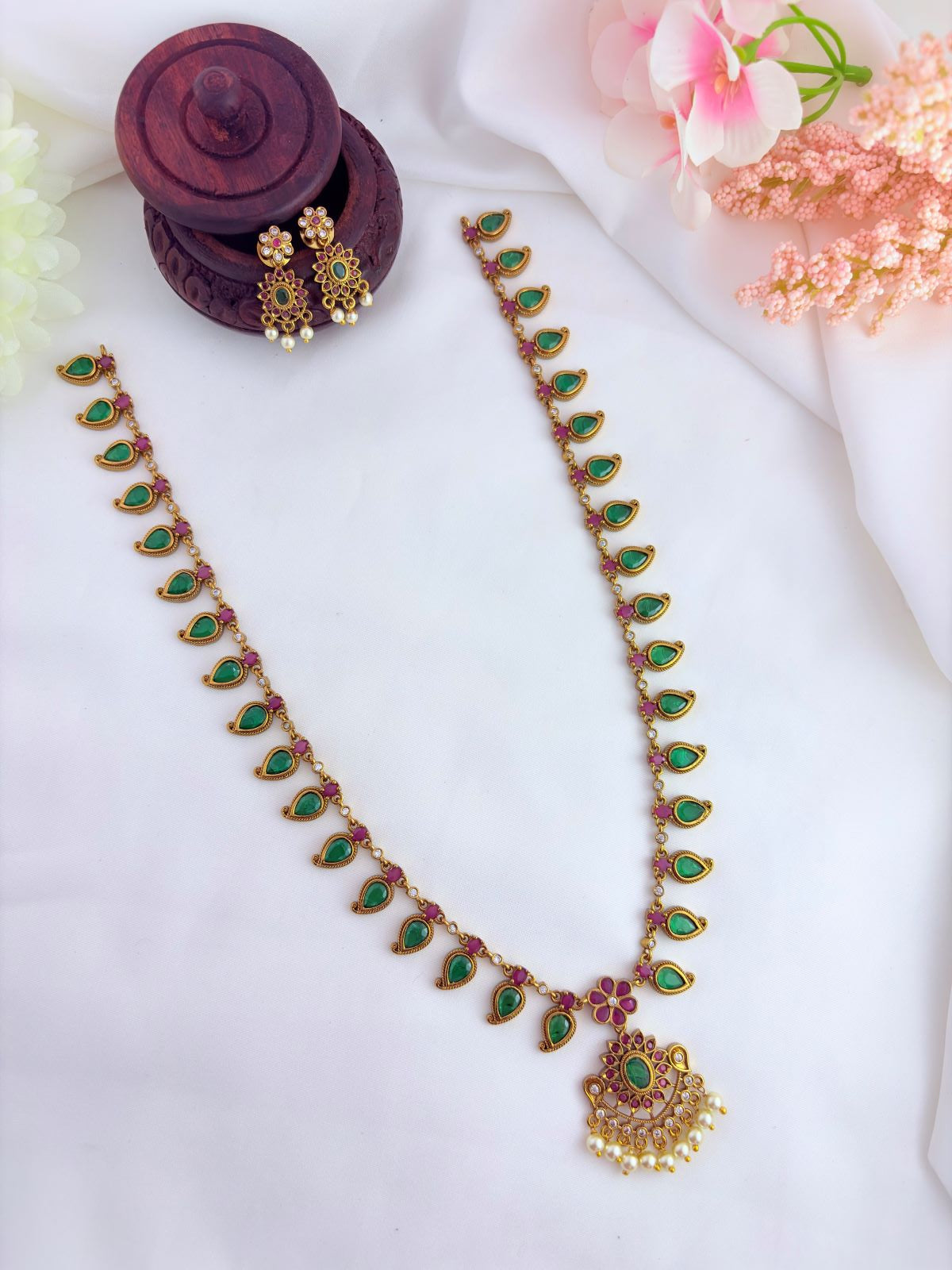 Premium matte finish palak haram and earrings adorned with pearl drops