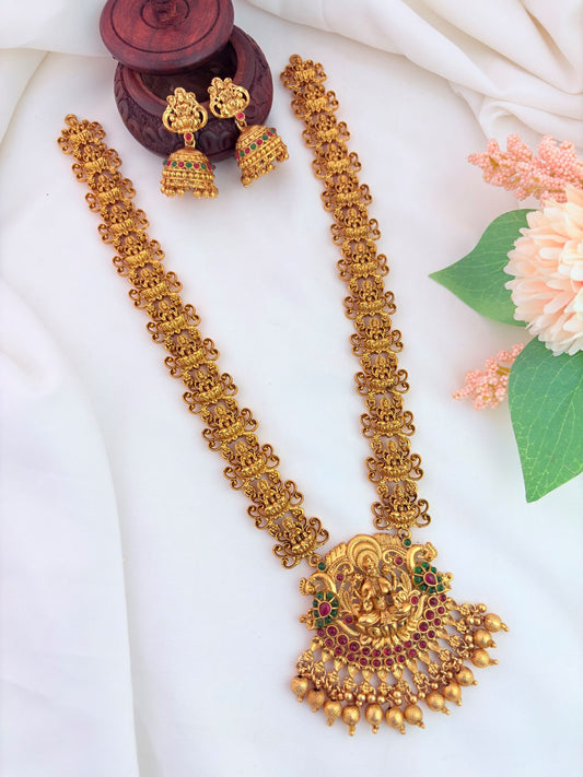 Traditional lakshmi pendant haram and jhumka adorned with golden beads