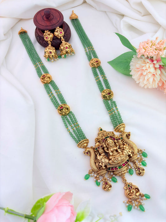 Temple jewellery -Lakshmi pendant haram and jhumka adorned with green beads