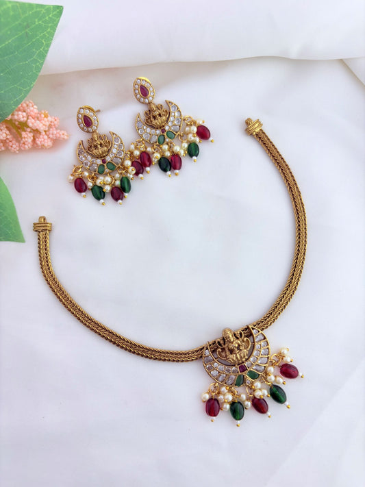 Tradition in Premium antique finish lakshmi pendant neckset with matching earrings