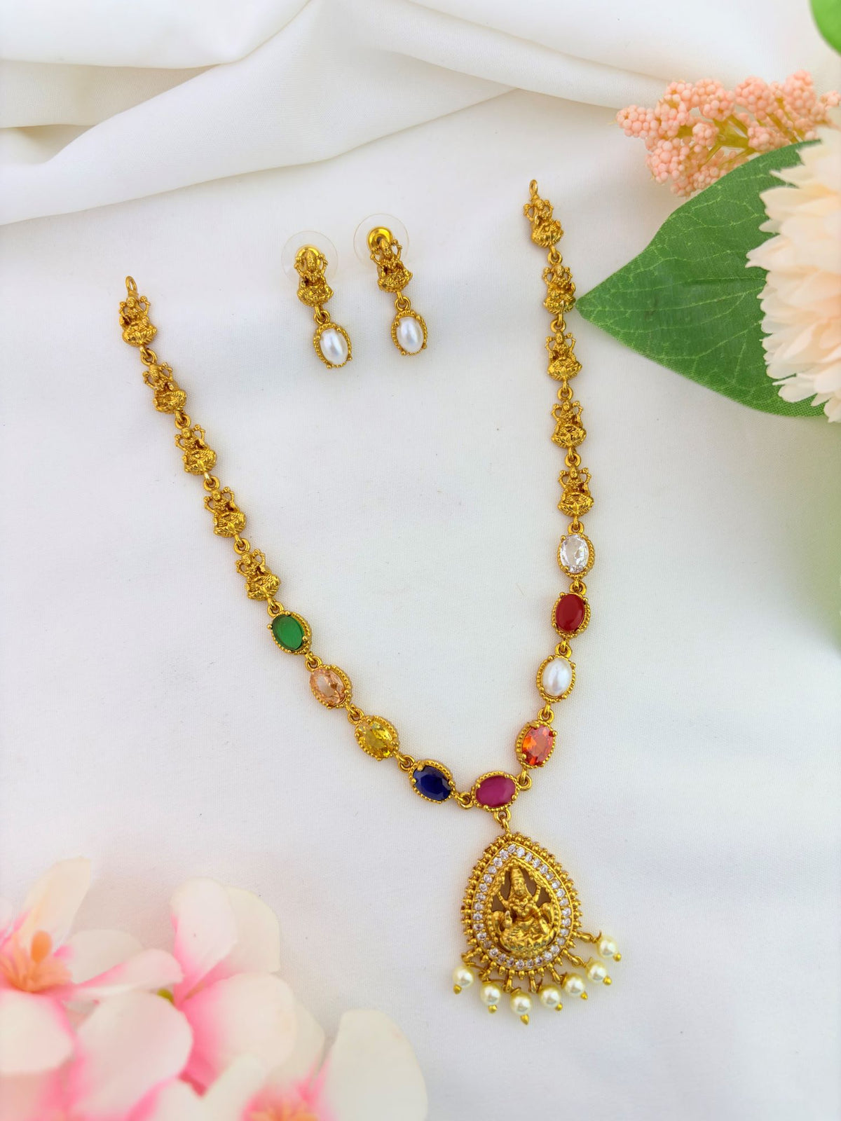 Elegant navaratna stones lakshmi pendant neckset adorned with pearls