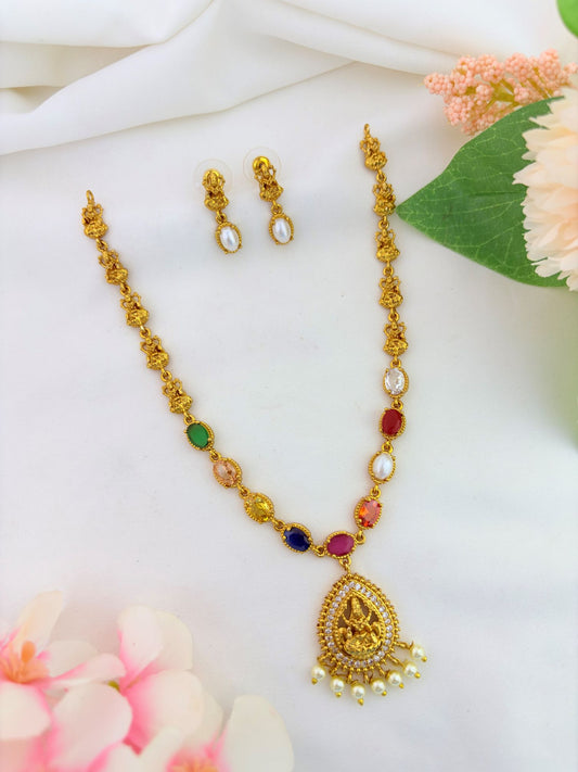 Elegant navaratna stones lakshmi pendant neckset adorned with pearls