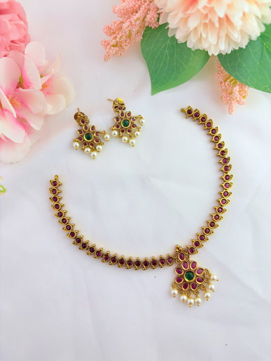 Traditional premium matte finish neckset in ruby and green stones