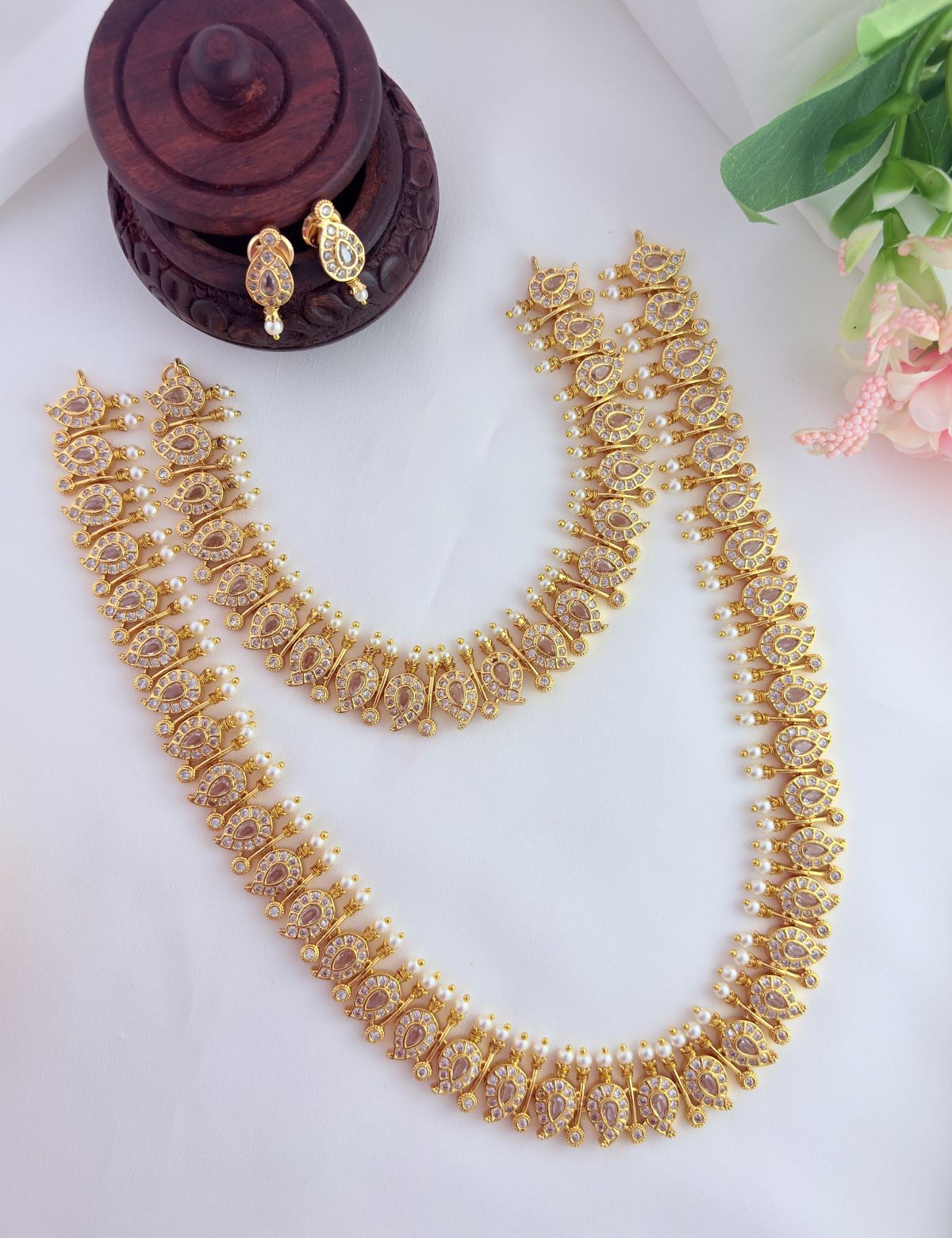 Traditional mango pattern combo set adorned with AD stones and pearls
