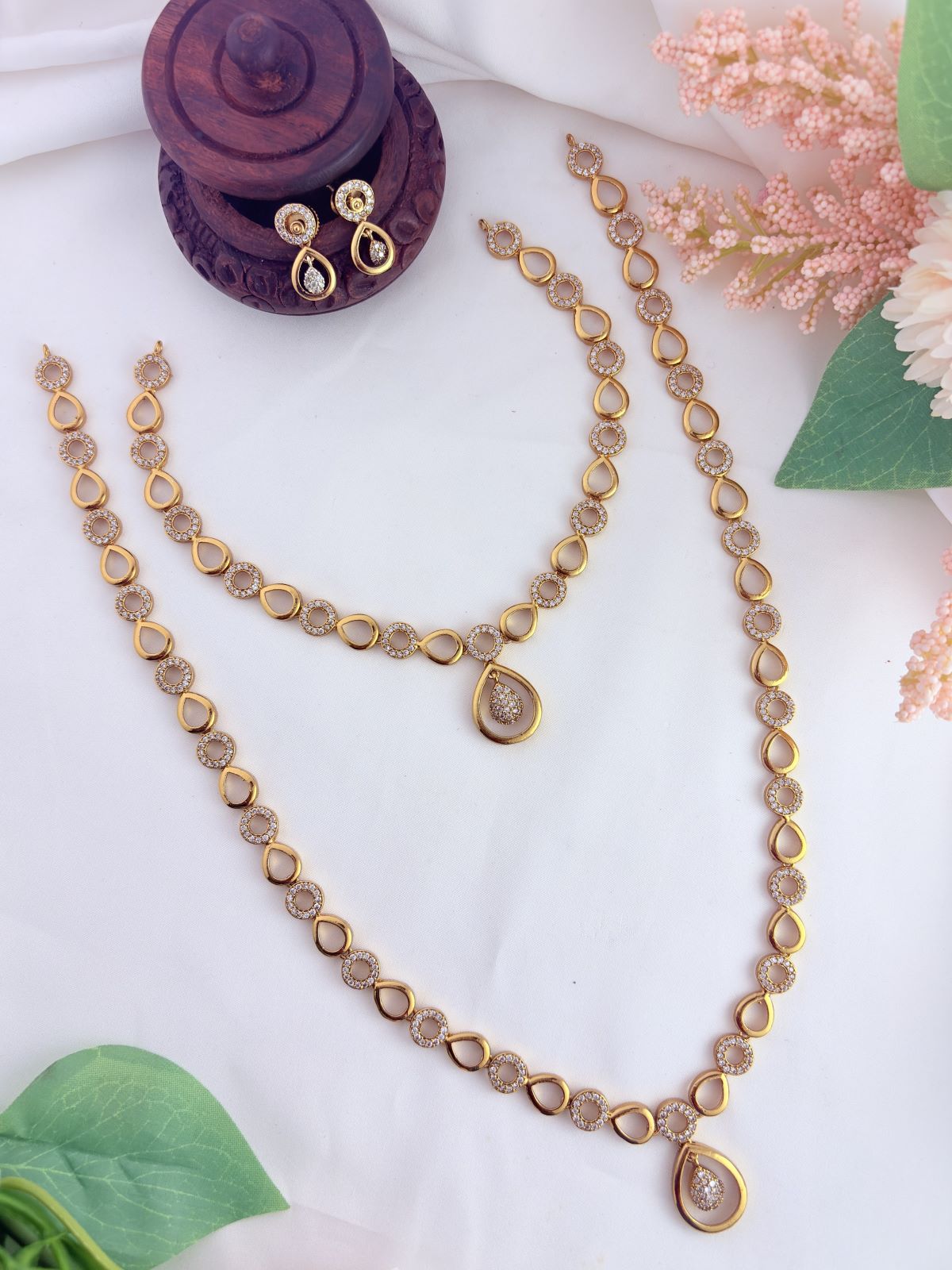Stylish and elegance adorned with AD stones - Premium matte finish haram with matching earrings