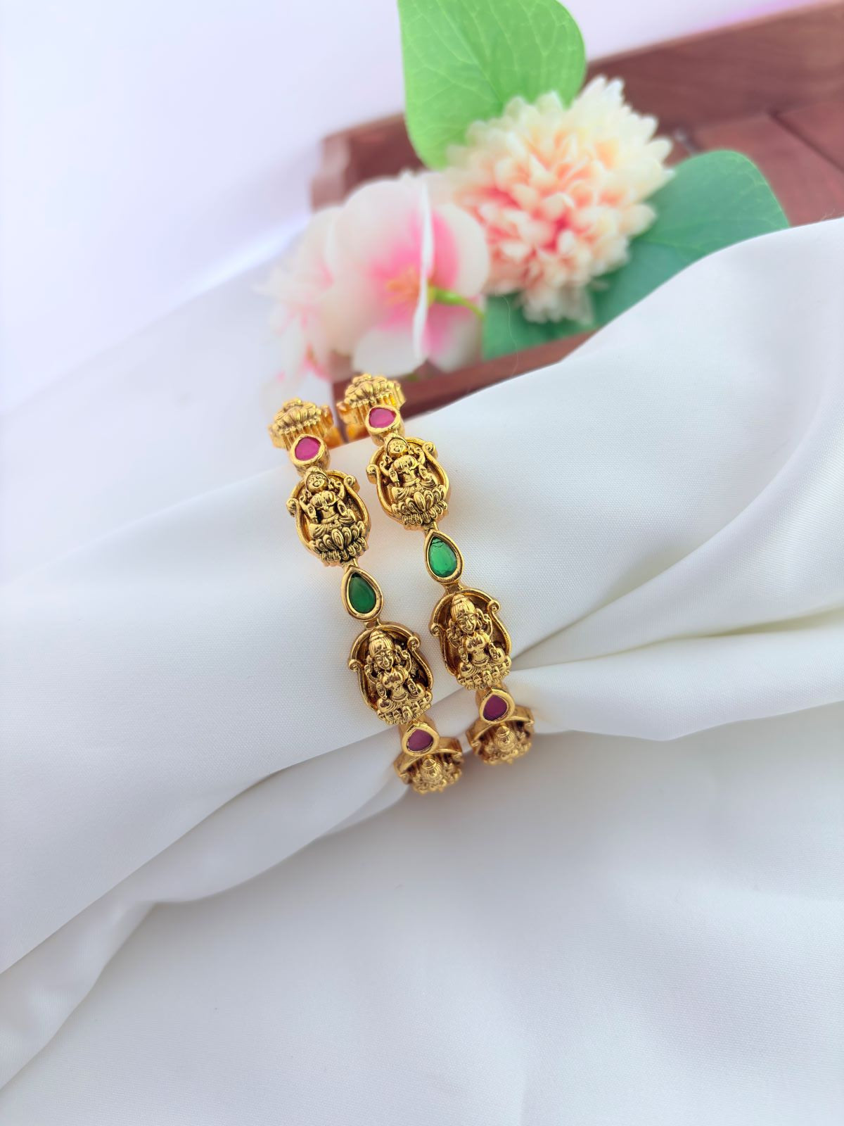 Beautifully crafted lakshmi design bangles featuring intricate traditional  detailing