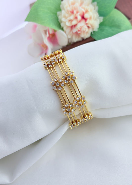 Elegant floral pattern bangles embellished with sparkling AD stones