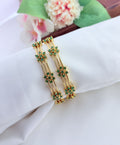 Elegant floral pattern bangles embellished with sparkling AD stones