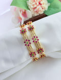 Elegant floral pattern bangles embellished with sparkling AD stones