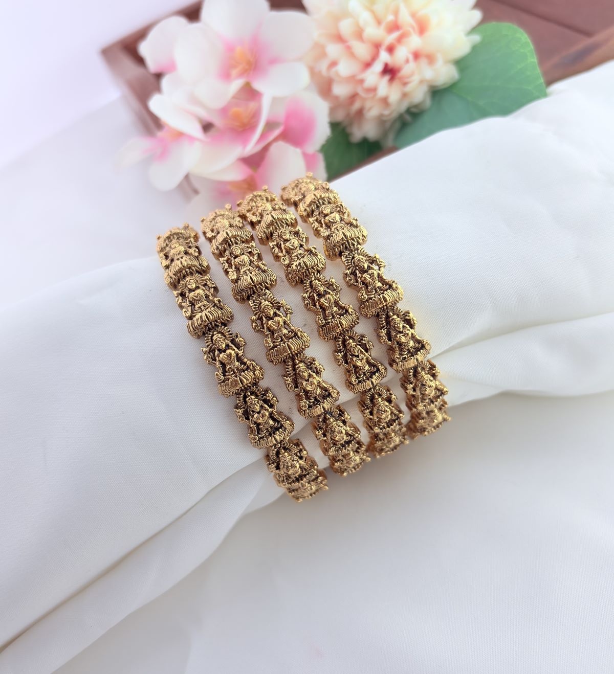Beautifully crafted matte finish lakshmi bangles adorned with traditional detailing for a  timeless ethnic look