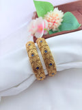 Beautiful peacock motif bangles featuring intricate craftsmanship for a graceful ethnic look