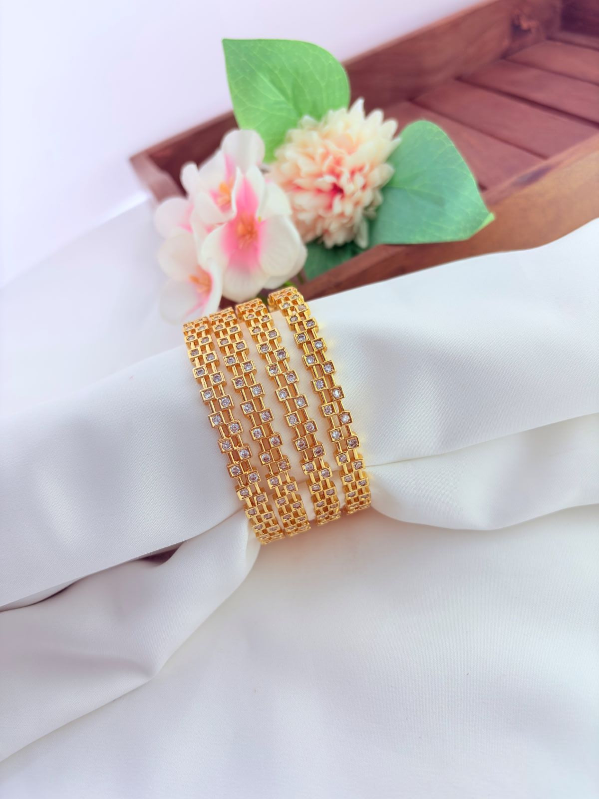 Exquisitely crafted AD stone bangles featuring intricate detailing and brilliant sparkle