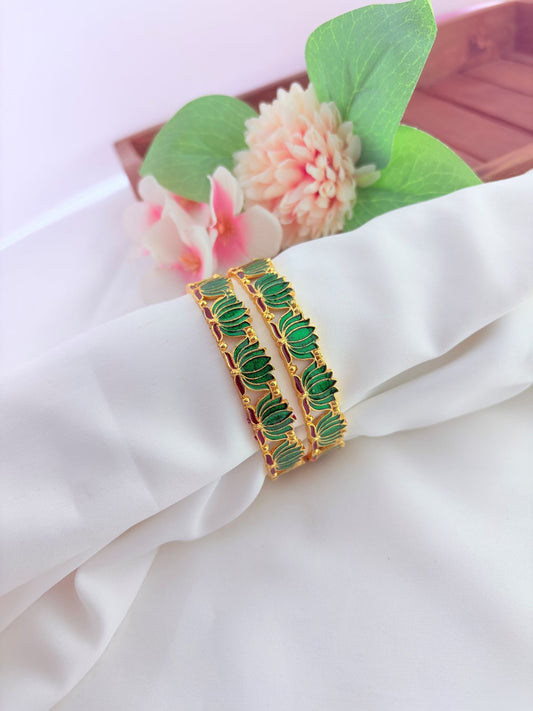 - Elegant lotus-inspired bangles crafted with fine detailing,symbolizing beauty and tradition