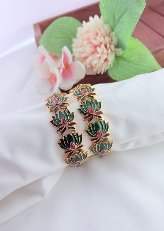 - Elegant lotus-inspired bangles crafted with fine detailing,symbolizing beauty and tradition