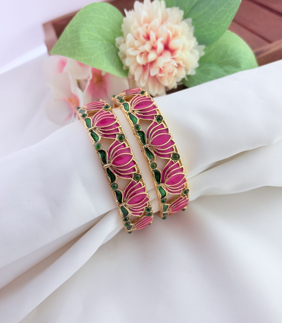 - Elegant lotus-inspired bangles crafted with fine detailing,symbolizing beauty and tradition
