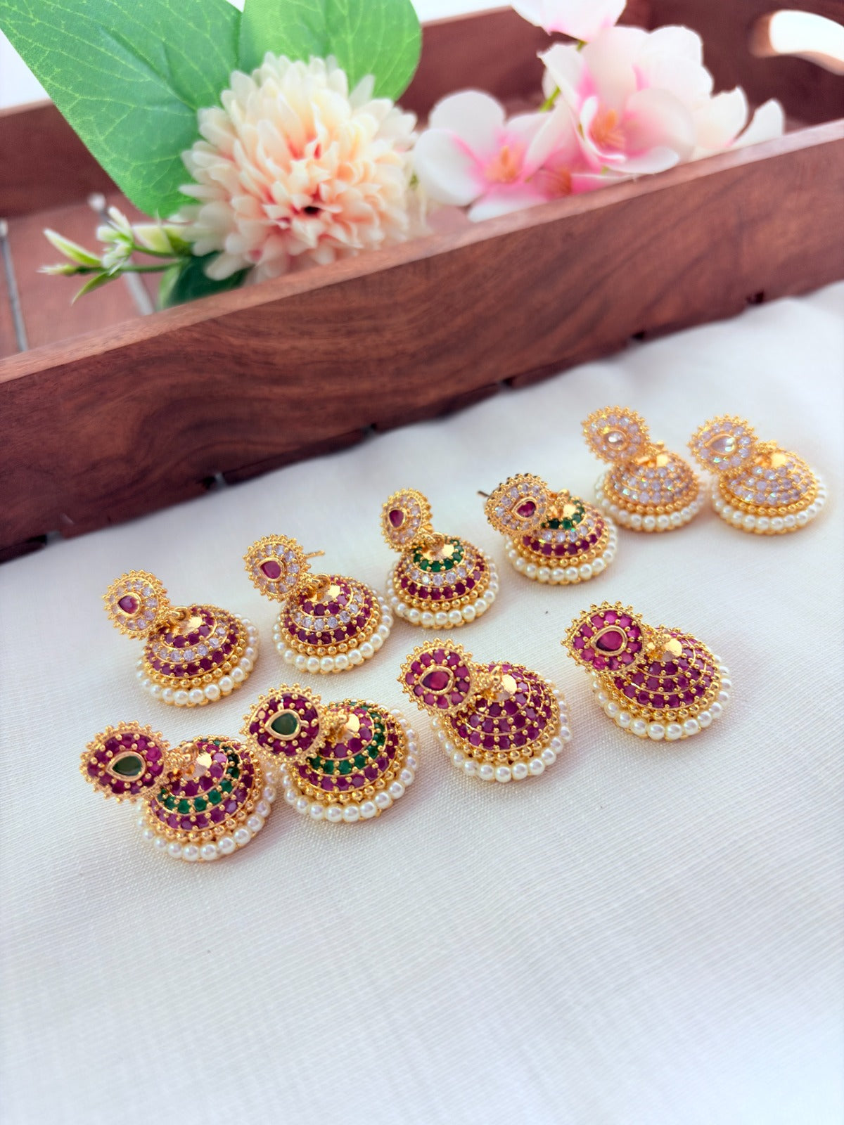 Premium matte finish jhumka beautifully crafted with classic AD stones and pearls