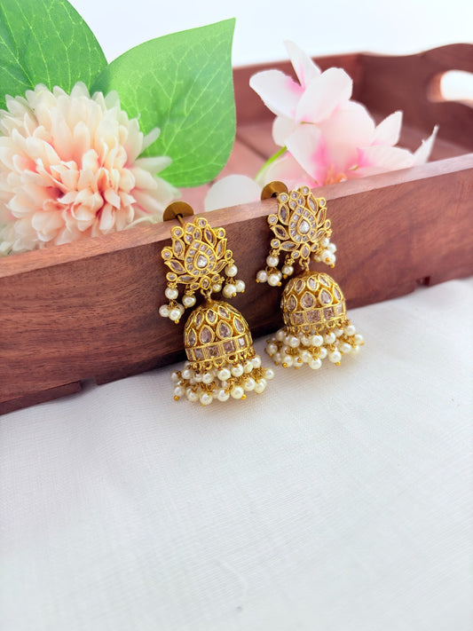 Traditional lotus motif jhumka in premium matte finish, adorned with stones and pearls