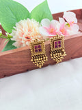 Premium matte finish traditional pattern earrings with golden beads