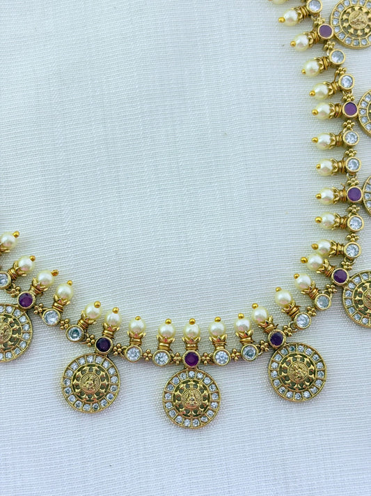 Traditional Lakshmi coin beautifully crafted with premium AD stones and pearl detailing