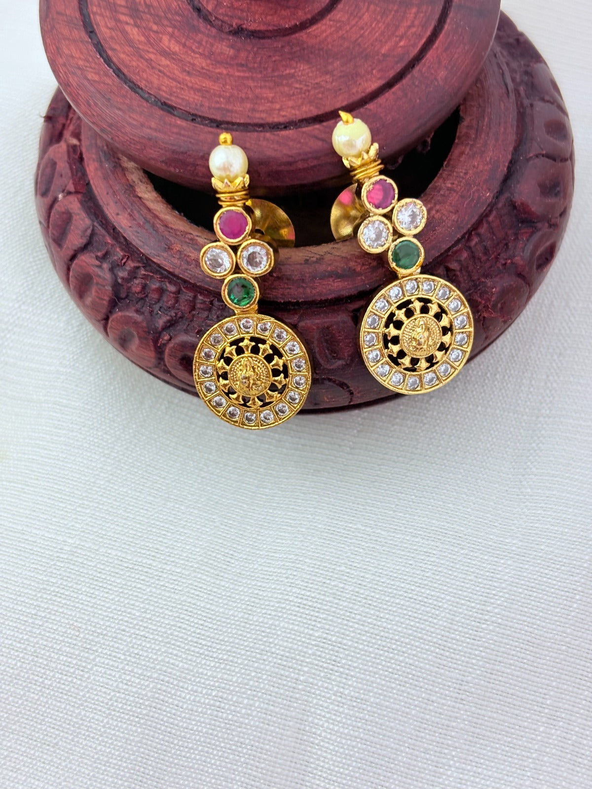 Traditional Lakshmi coin beautifully crafted with premium AD stones and pearl detailing