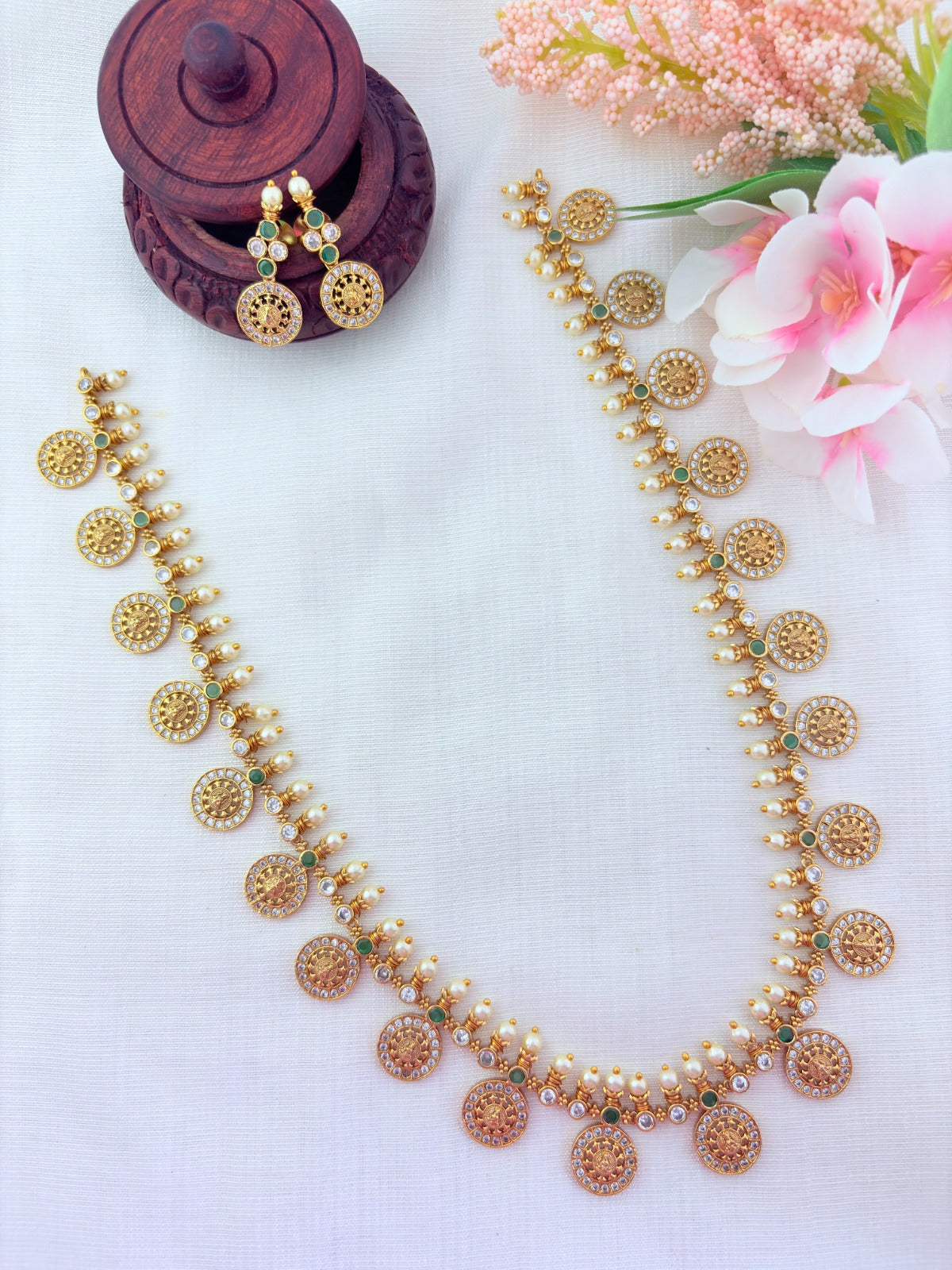 Traditional Lakshmi coin beautifully crafted with premium AD stones and pearl detailing