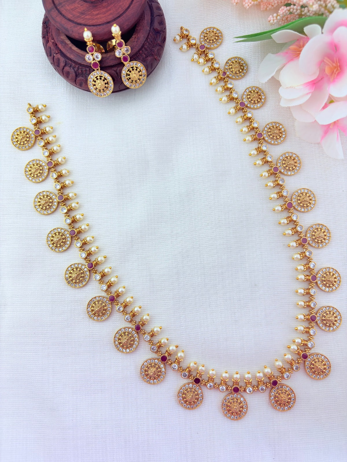 Traditional Lakshmi coin beautifully crafted with premium AD stones and pearl detailing