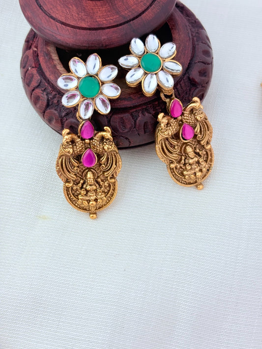Matte finish peacock bridal haram and earrings adorned with classic stones