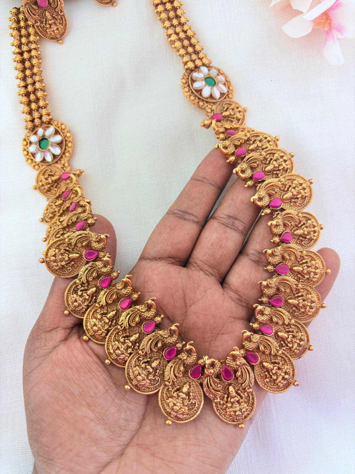 Matte finish peacock bridal haram and earrings adorned with classic stones