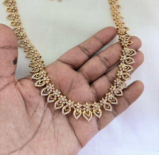 Elegant floral and leaf pattern premium AD matte finish haram with matching earrings