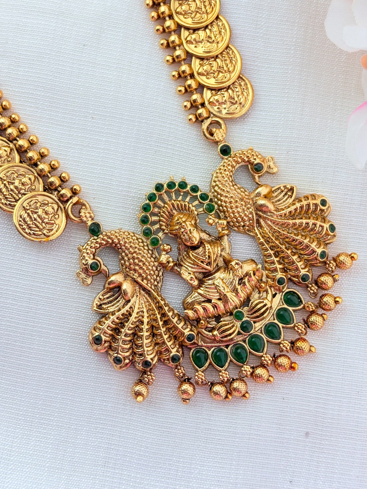 Matte finish Laskhmi coin haram with pendant and matching jumkha adorned with classic stones and golden beads