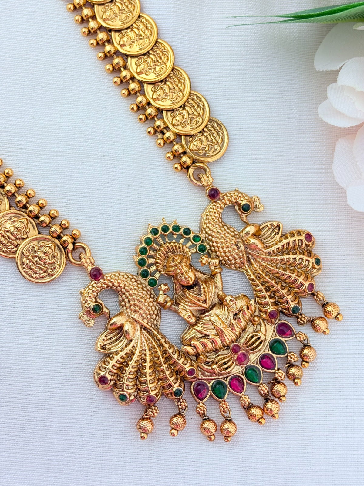 Matte finish Laskhmi coin haram with pendant and matching jumkha adorned with classic stones and golden beads