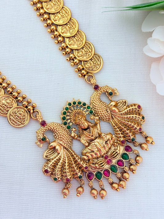 Matte finish Laskhmi coin haram with pendant and matching jumkha adorned with classic stones and golden beads