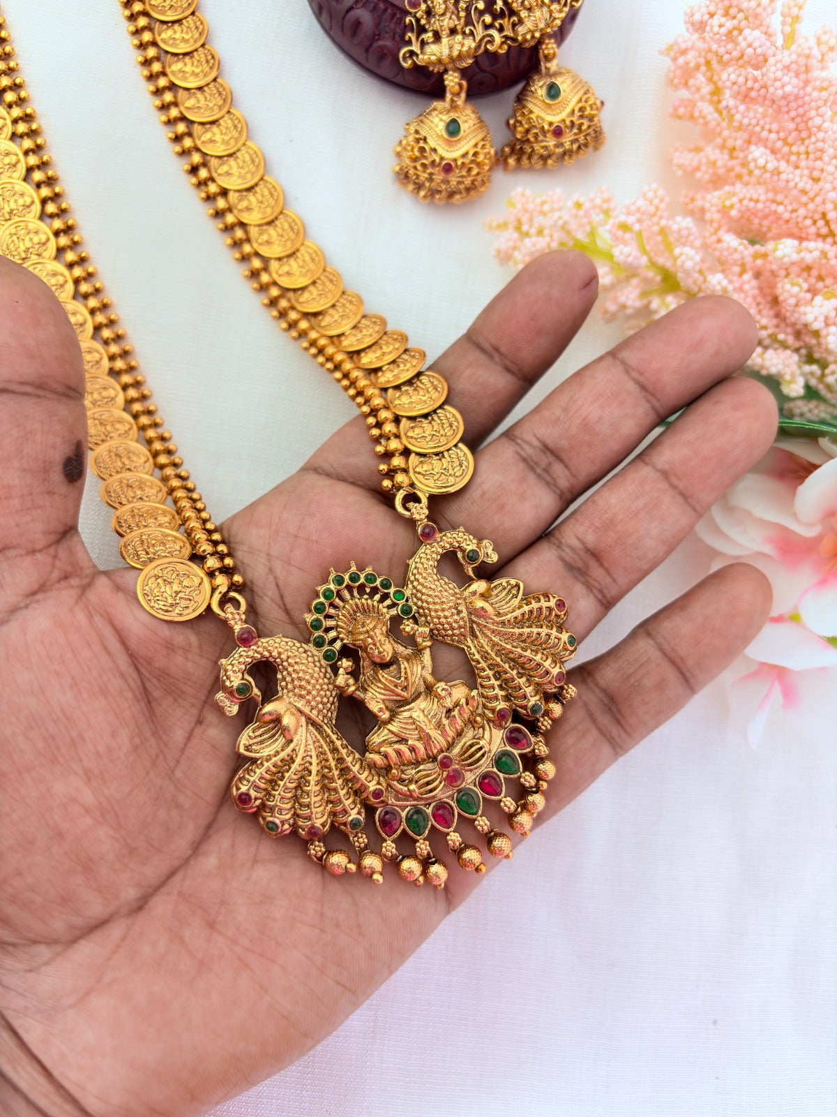 Matte finish Laskhmi coin haram with pendant and matching jumkha adorned with classic stones and golden beads