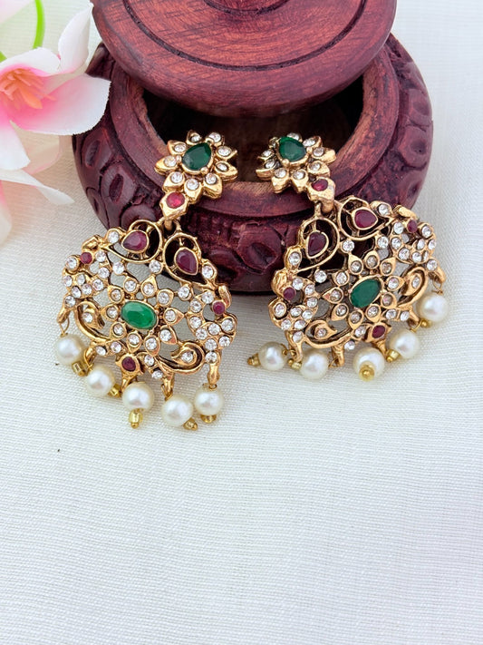 Stylish   beads haram featuring a statement pendant and matching earrings adorned with pearl drops