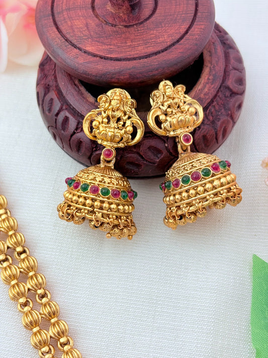 Matte finish Lakshmi pendant haram and matching jumkha adorned with golden beads