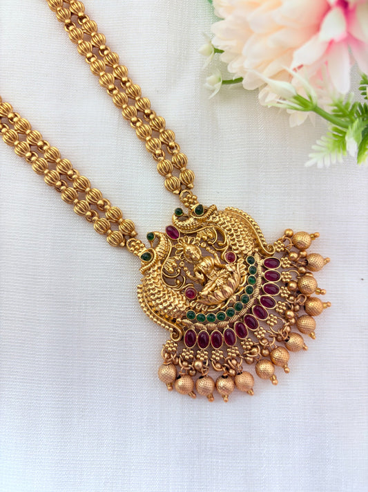 Matte finish Lakshmi pendant haram and matching jumkha adorned with golden beads