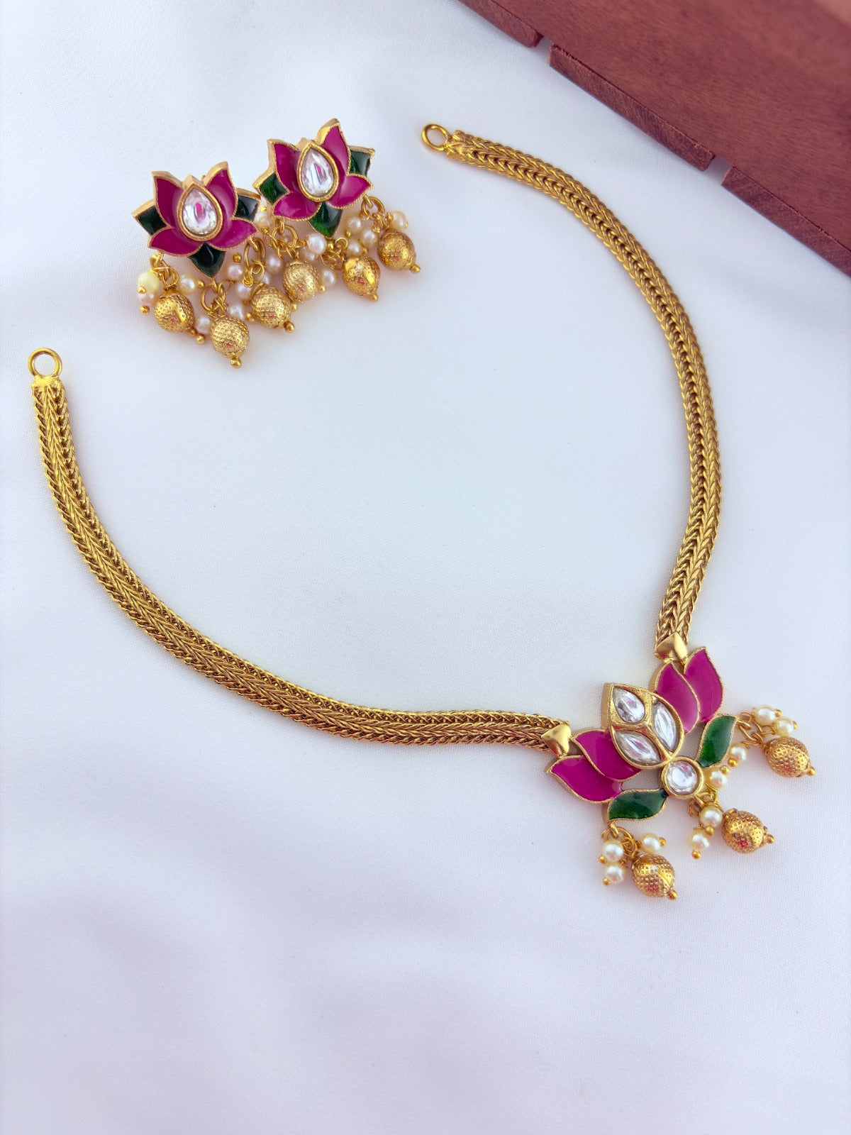 Premium lotus motif neckset highlighted with golden beads and enamel work