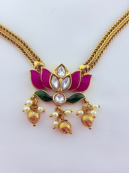 Premium lotus motif neckset highlighted with golden beads and enamel work